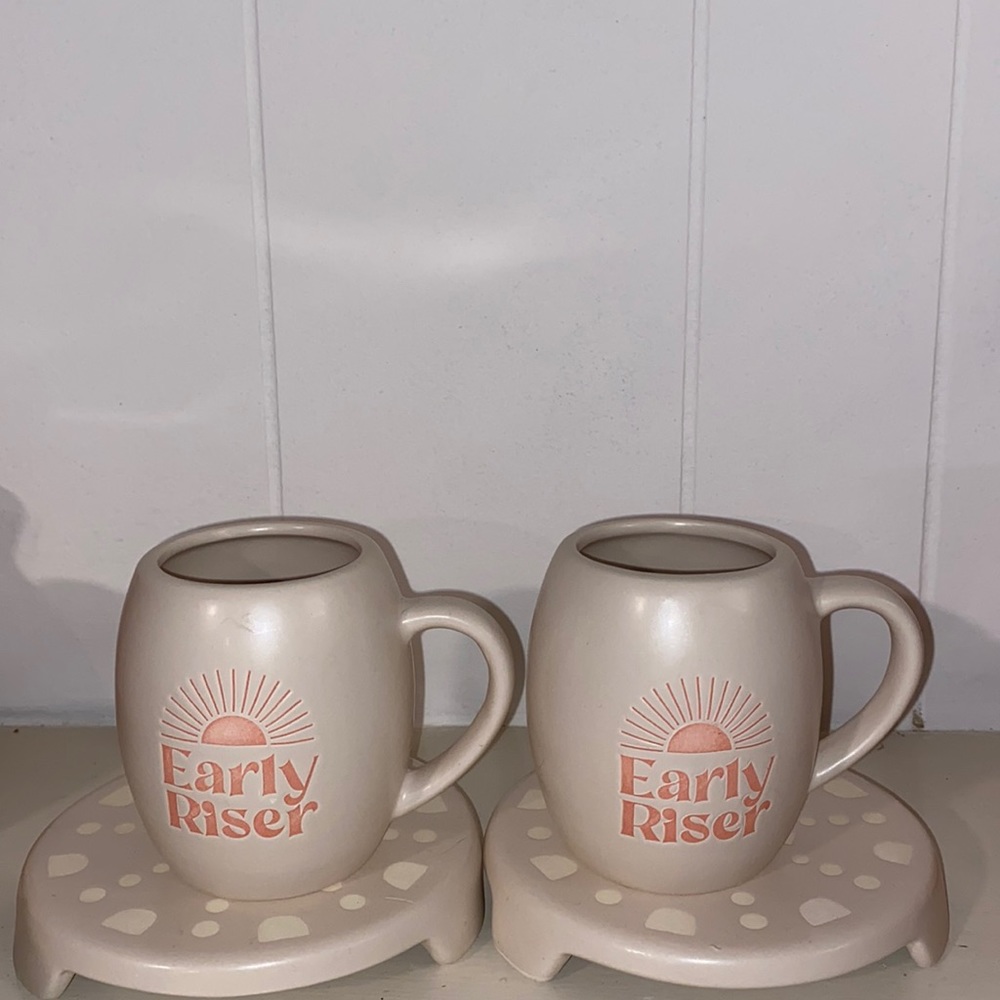 Two coffee cups or tea cup and treat.